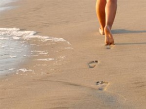 barefeet walking on sand