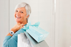 Portrait of a happy young woman holding a bag feeling freedom because she has her PERS Response system