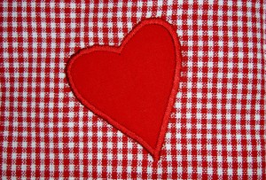 red heart on red and white checkered gingham