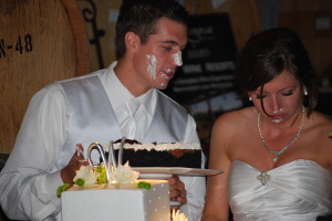 the bride and groom tasting their wedding cake.