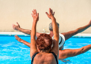 active seniors exercising in a swimming pool