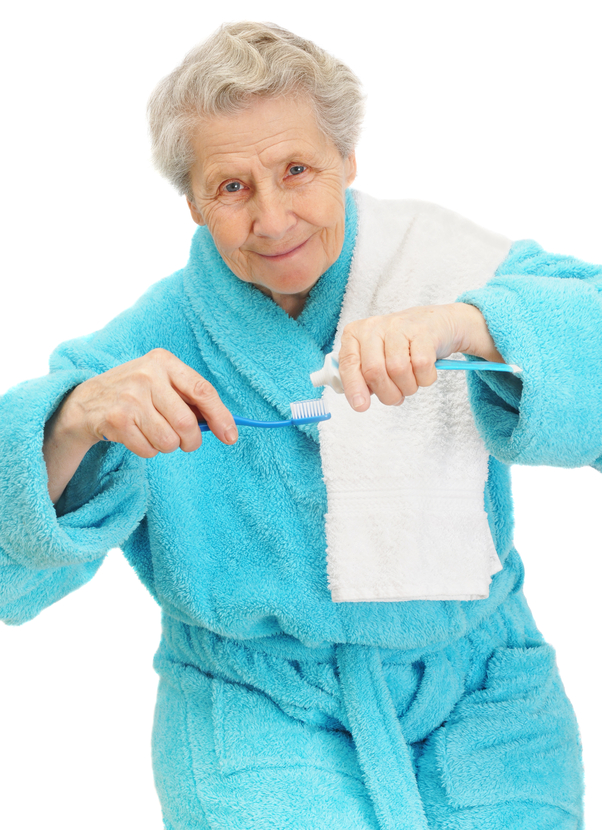 senior lady getting ready to brush her teeth
