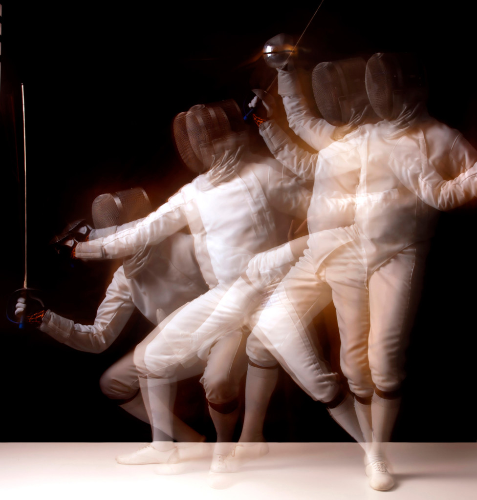 fencer isolated on a dark background