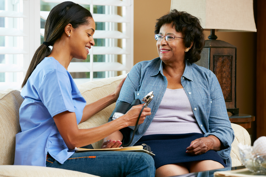 nurse visiting a senior client in her home