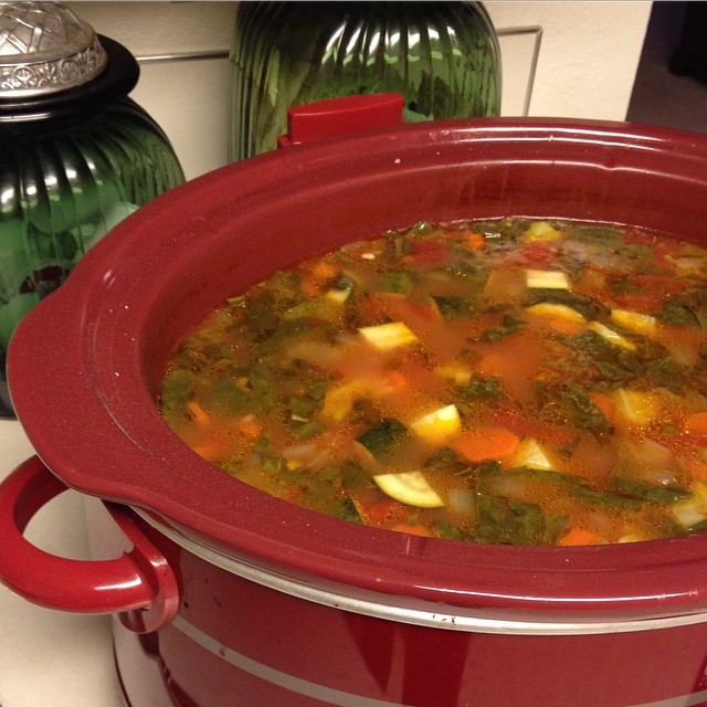 minestrone soup in a red slow cooker