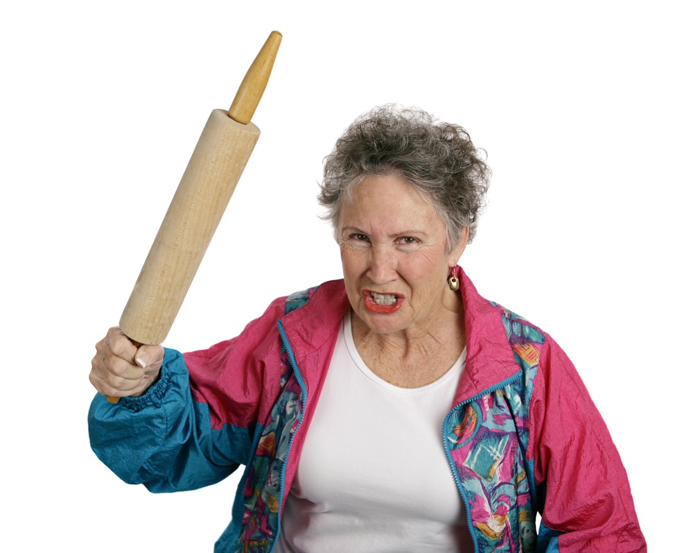 elderly lady with a rolling pin clenched in her fist