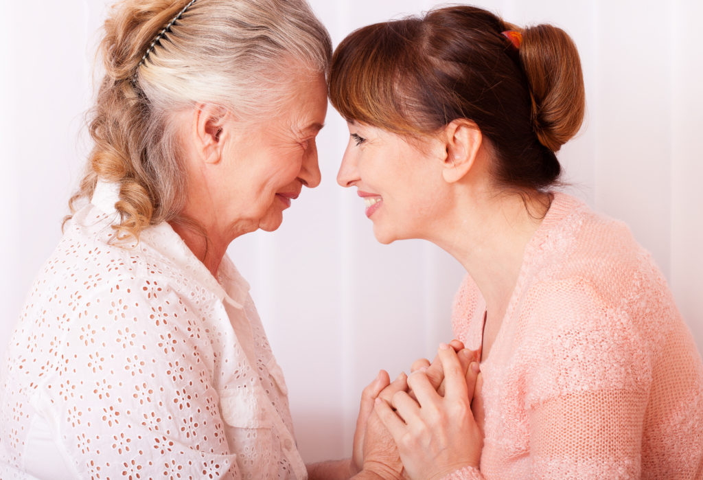 Seniors woman with her caregiver at home