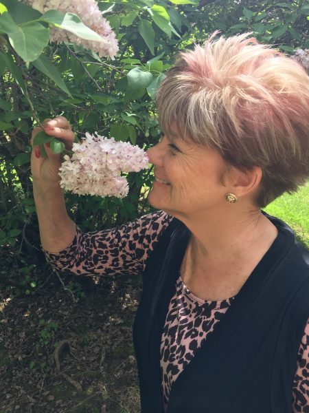 shelley smelling a while lilac