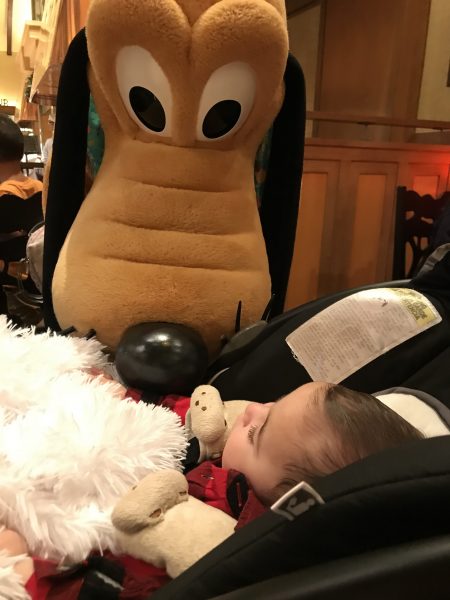 Pluto kissing the baby