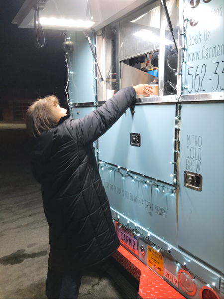Sandra, getting hot chocolate from a food truck