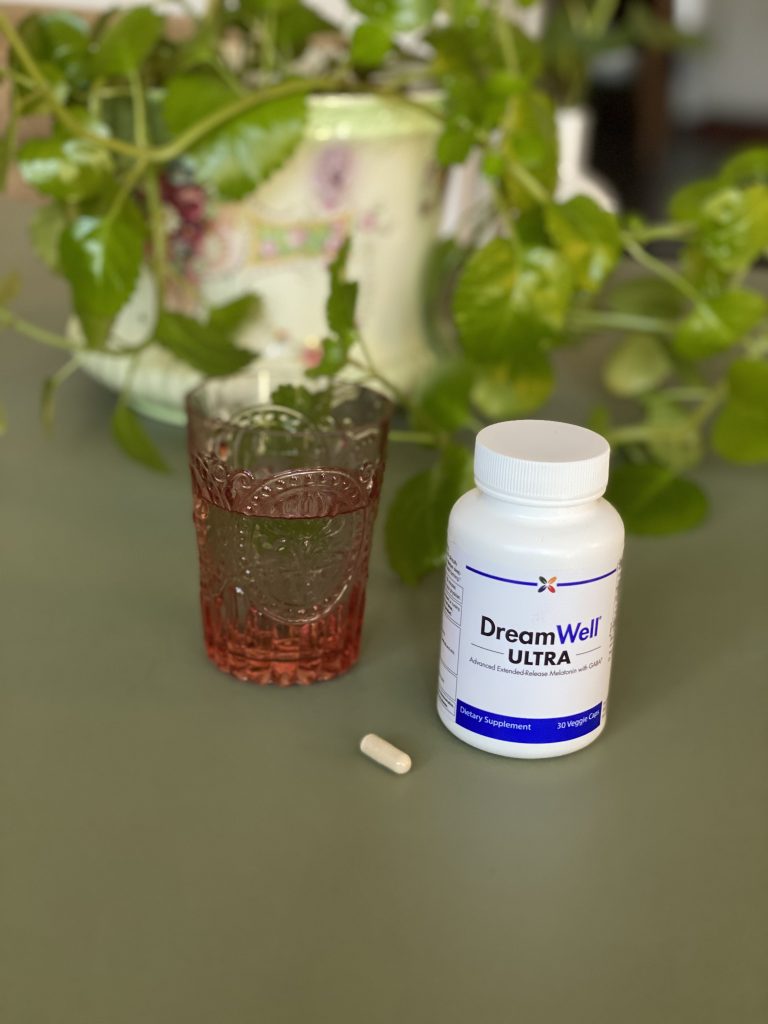 DreamWell bottle with a capsule beside it.