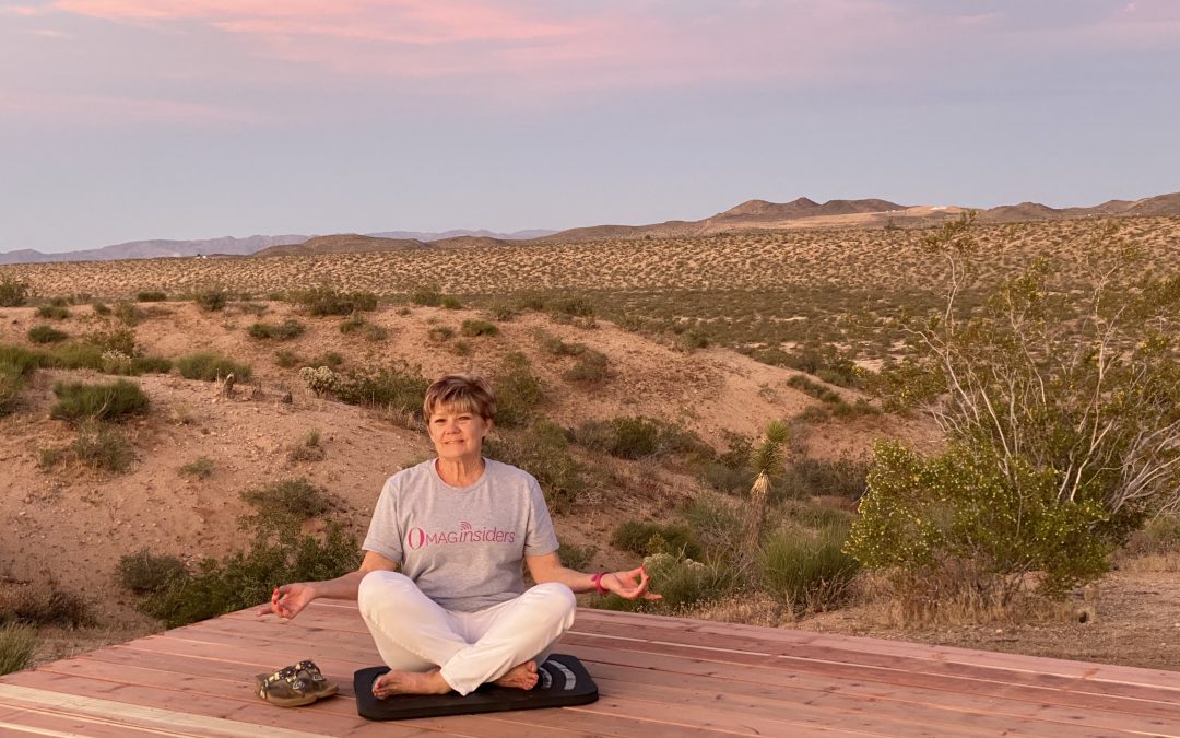 Shelley Sitting cross-legged on the meditation deck in Yucca Valley