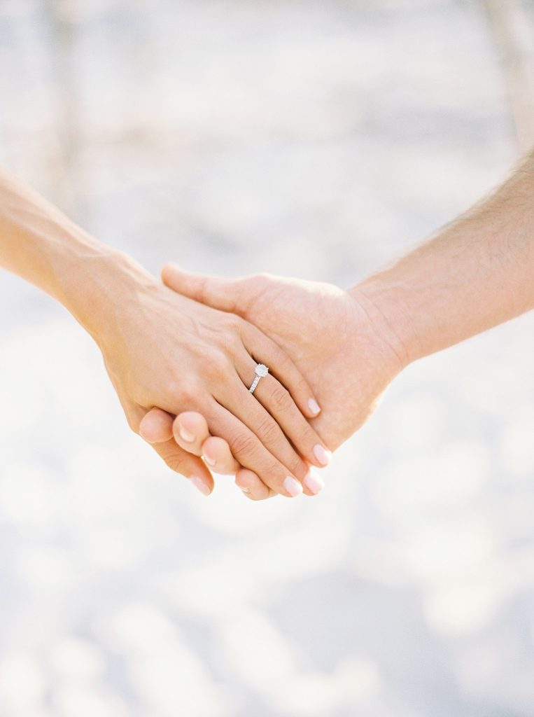 2 people holding hands