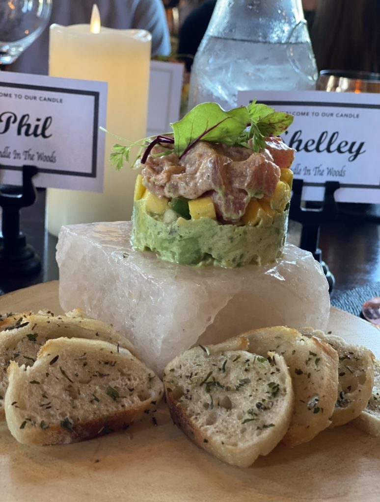 tuna tartare atop a frozen himalayan salt block served with slices of baguette