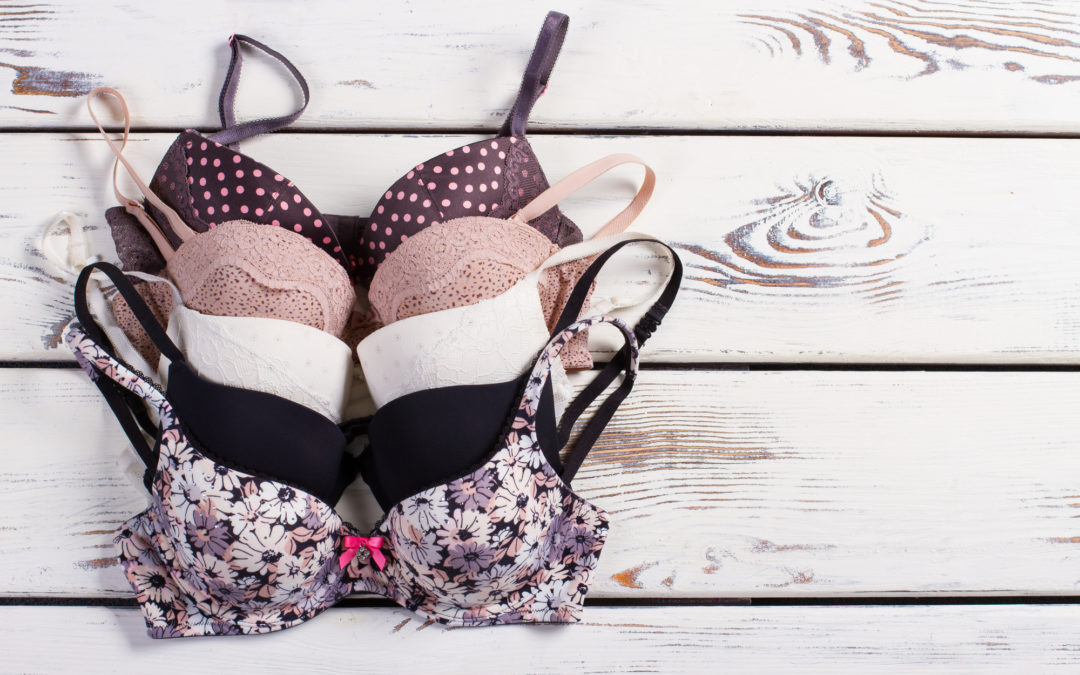 5 patterned bras on a wooden background