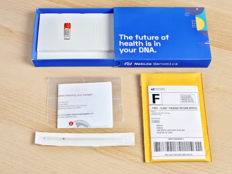 The Nebula genomics kit opened, with instructions and a postage-paid return envelope