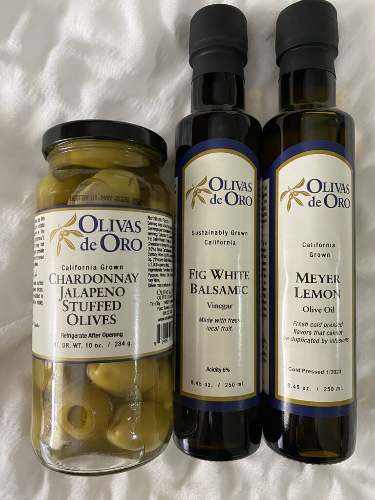 bottles of olives, olive oil and white balsamic vinegar