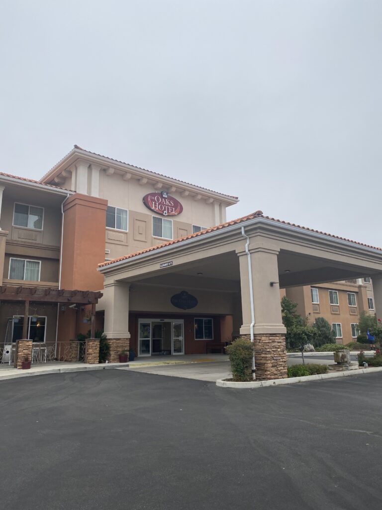 The front entrance of The Oaks Hotel