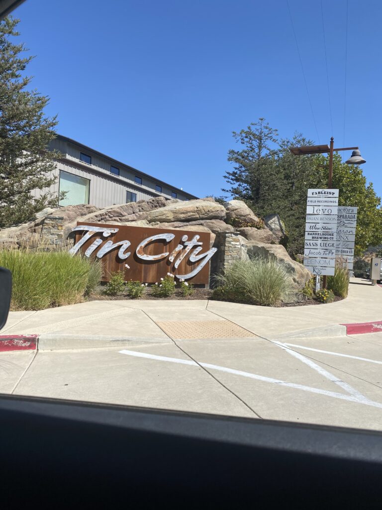 The Tin City sign on the corner